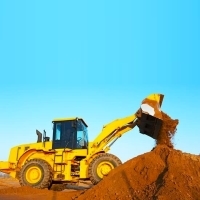 a construction site with a bulldozer and a pile of dirt