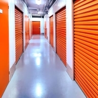 a hallway with orange storage units