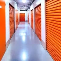 a hallway with orange storage units