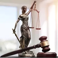 a statue of lady justice holding a gavel