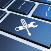 a computer keyboard with a wrench and wrench symbol