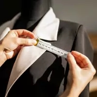 a woman measuring her waist with a measuring tape