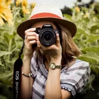 a woman taking a picture with a camera