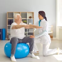 a nurse helping a patient with a physical exercise