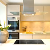 a kitchen with a stove, oven, and sink