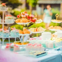 a table with a variety of desserts and cakes