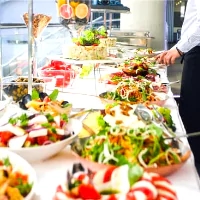 a buffet table with a variety of food on it
