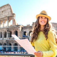 a woman in a yellow dress and a straw hat