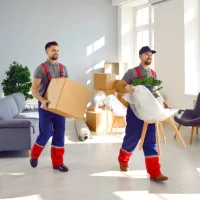 a picture of a man carrying a box