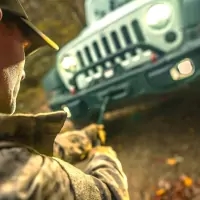a man in a hat and a jacket holding a gun