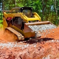 a construction site with a bulldozer moving dirt