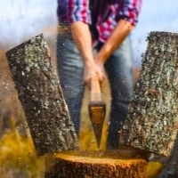 a person using a wooden spoon to cut a piece of wood